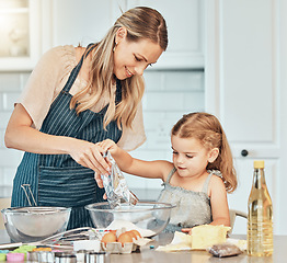 Image showing Mom, girl kid and teaching for cooking, development and skills with bonding, love and care in family home. Baking, mother and daughter with bowl, flour and eggs on table, kitchen and helping for food