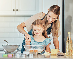 Image showing Mom, girl child and learning with whisk, development and skills with bonding, love or care in family house. Cooking, mother and daughter with smile, flour and eggs on table, kitchen and help for food