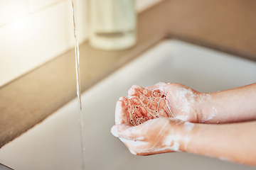 Image showing Water, washing hands and kid with foam for cleaning, hygiene and wellness in bathroom at home. Health, child development and palms of young girl with soap for protection for germs, virus and bacteria