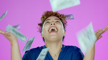 Image showing Woman, winner and wow for money rain success, bonus or winning of lottery prize, profit or cashback in studio. Happy african person, cash in air and financial freedom or celebrate on pink background