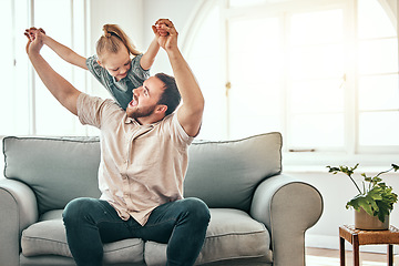 Image showing Father, girl kid and airplane on sofa, smile and playful for love, care and bonding in living room at family home. Dad, daughter and plane game, excited and relax together on lounge couch in house