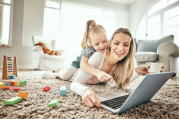 Image showing Mother, child and laptop for home games, e learning and happy video streaming or education on carpet in living room. Mom, family and girl play on floor and computer for kids website or online school