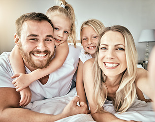 Image showing Selfie, smile and portrait of family on the bed for bonding and relaxing together at modern home. Happy, love and girl children laying and taking a picture with parents from Australia in bedroom.
