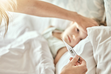 Image showing Parent, hands and thermometer with sick child in bed for fever, cold or flu virus at home. Closeup of mother checking child with illness for temperature or measurement in bedroom or rest at house