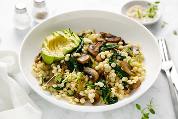 Image showing Couscous with avocado, spinach and sauteed champignon mushrooms with onion