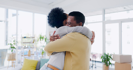 Image showing Black couple, hug and embrace with love, happy and living room in home, bonding and joy. Quality time, together and romantic with man, woman and intimate relationship with romance, reunion and smile