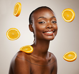 Image showing Black woman, portrait and skincare with orange, fruit and natural vitamin c benefit in beauty or studio background. Citrus, cosmetics and face with glow, shine or wellness from dermatology or facial