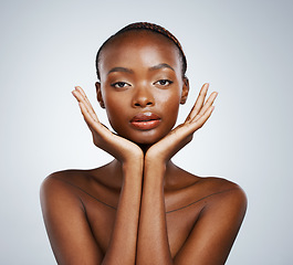 Image showing Portrait, skin and hands of a black woman in studio on a gray background for skincare, beauty or natural wellness. Face, spa or luxury and a young model with cosmetic or antiaging aesthetic treatment