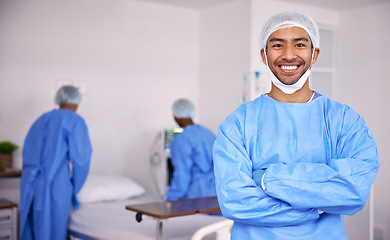 Image showing Happy asian man, doctor and arms crossed of professional in ICU with medical team for healthcare service at hospital. Portrait of male person, surgeon or nurse smile in confidence or health at clinic