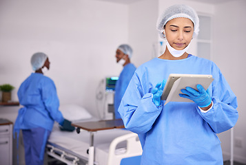 Image showing Woman, doctor and tablet in research at hospital for communication, Telehealth or networking at hospital. Female person, medical nurse or professional surgeon with technology for schedule at clinic
