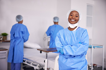 Image showing Happy black woman, doctor and arms crossed of professional in ICU, medical or team in healthcare service at hospital. Portrait of African female person, surgeon or nurse smile in confidence at clinic