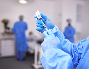 Image showing Hands, healthcare and syringe with a doctor in scrubs at the hospital for treatment of disease. Medical, injection and needle with a medicine professional or surgeon getting ready for an operation