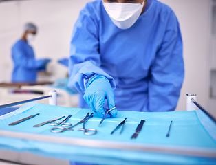 Image showing Nurse, surgery and prepare tools in operation, medical equipment and scissors for procedure. Surgeon, hospital and scrubs for protection, medical service and surgical tools in theatre for emergency