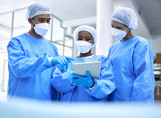 Image showing Doctor, tablet and team with mask in meeting, planning or collaboration for surgery at hospital. Group of medical employees with technology in teamwork, consulting or healthcare strategy at clinic