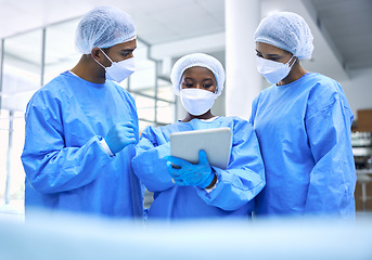 Image showing Doctor, tablet and meeting with mask in planning or collaboration for surgery ideas at hospital. Group of medical employees with technology in teamwork, consulting or healthcare strategy at clinic