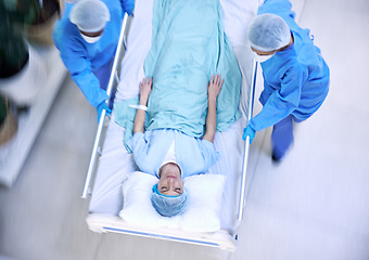 Image showing Doctors, team and hurry with bed in hospital for medical emergency, surgery operation or helping from above. Healthcare group running fast in rush, motion blur and urgent patient assessment in clinic