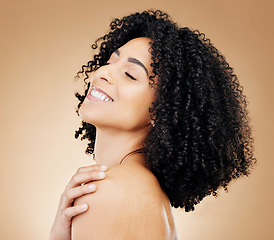 Image showing Woman, happy and beauty, hair and natural curls, salon treatment and shine, healthy skin glow on studio background. Skincare, dermatology and clean makeup, haircare and texture with afro and smile