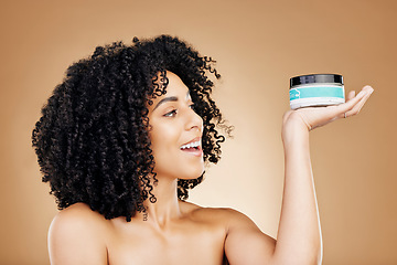 Image showing Studio skincare, face and happy woman with cream container, SPF sunscreen or facial melasma prevention. Cosmetics lotion, happiness and person smile for collagen hydration product on brown background