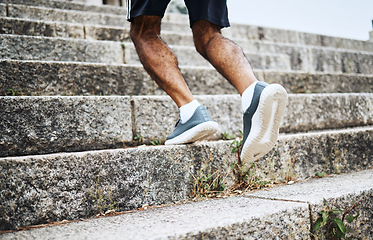 Image showing Man, legs and running on stairs in fitness for workout, training or outdoor cardio exercise. Closeup of male person, shoes or feet on steps for sports, health or wellness in an urban town or city