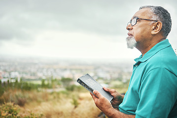 Image showing Bible, praying or senior man in nature for praise, hope or Christian religion with holy mindfulness. Prayer moment, calm pastor or mature person in worship with faith, spiritual and sky mockup