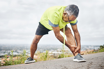 Image showing Mature, man and stretch from exercise by road for recovery, wellness or joint pain for better health. Elderly person, fitness or workout for strength, power or cardio for rehabilitation in retirement