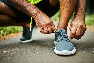 Image showing Man, tie and shoes in fitness for running, workout or outdoor exercise on road, street or asphalt. Closeup of male person, hands and tying shoe getting ready or preparation for sports, cardio or run