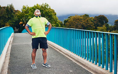 Image showing Fitness, tired or senior man on bridge for walking or trekking journey or adventure for freedom on break. Hiking, relax or exhausted mature hiker with fatigue in exercise, fitness or workout in Peru