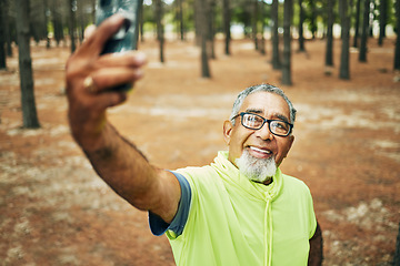 Image showing Selfie, smile and senior man hiking for health, wellness or cardio training on a mountain. Happy, nature and excited elderly male person taking a picture on cellphone for outdoor trekking in woods.