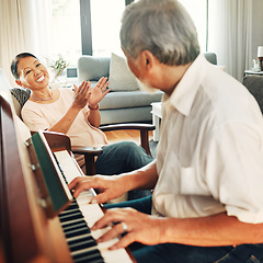 Image showing Smile, piano and senior man playing a song to his wife for music in living room with bonding or entertainment. Happy, instrument and elderly Asian couple in retirement enjoy keyboard at modern home.