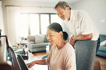 Image showing Piano, music and a senior asian couple in their home together for love or romance in retirement. Smile, art or creative with a happy elderly man and woman playing an instrument in their house