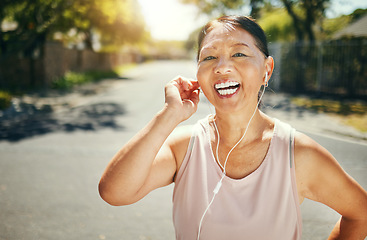 Image showing Fitness, music earphones and portrait of Asian woman outdoor for sports training, exercise and healthy body. Happy face, mature athlete listening to radio in street and excited for streaming podcast