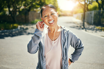 Image showing Fitness, earphones and portrait of happy Asian woman outdoor for sports training, exercise and healthy body. Face, mature person listening to music in street and streaming audio podcast to workout