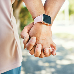 Image showing Closeup, holding hands and support with trust for love in bond, together or romance while walking. Elderly couple, man and woman in retirement with exercise for wellness, health or smart watch