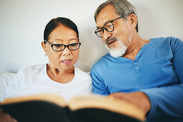 Image showing Bible, home or senior couple reading book for prayer, support or hope in bed to worship together. Education, Asian man or mature woman learning or studying God for grace in religion with love or care