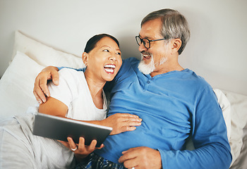 Image showing Happy couple, bedroom and tablet with home streaming and watch funny video, social media or online meme. Mature man and woman hug or relax in bed on digital technology for film or movies subscription