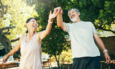 Image showing Asian couple, senior and dance in park with smile for date, peace and romance with sunlight. Elderly, man and woman or holding hands outdoor in nature or backyard for bonding, fun and love or care