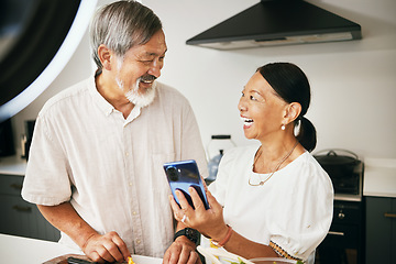 Image showing Home, influencer and senior couple with a smartphone, social media and connection with conversation. Kitchen, elderly man or old woman with a cellphone, content creation and digital app with internet