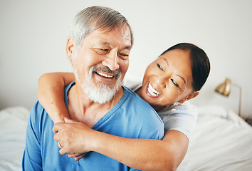 Image showing Senior, laughing or happy couple hug in house bedroom together to relax on holiday with bond or support. Embrace, funny or romantic Asian man with a mature woman with love, smile or care in marriage