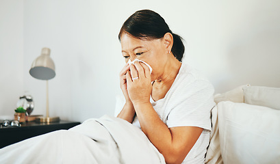 Image showing Blowing nose, bed or sick senior woman in bedroom in house with flu virus, cold or health problem. Sneeze, mature or Asian lady with tissue toilet paper, fever or allergy illness in home bedroom