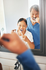 Image showing Senior couple, brushing teeth and mirror in bathroom, hygiene and dental, morning routine at home. Healthy people, wellness and oral care with grooming, toothpaste for cleaning mouth and reflection