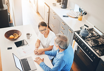Image showing Couple, laptop and home documents for finance, loan payment and mortgage planning, support and love in kitchen. Mature woman and man holding hands for banking and paperwork solution on computer above