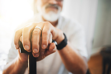 Image showing Hands, walking stick and elderly man in home for support, healthcare or help in retirement. Closeup, lonely senior with disability and aid of cane for parkinson, arthritis or rehabilitation of stroke