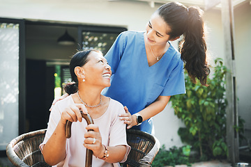 Image showing Senior woman, happy nurse and garden for health support, .conversation and wellness in retirement or nursing home. Medical doctor talking to elderly patient with disability and walking stick outdoor