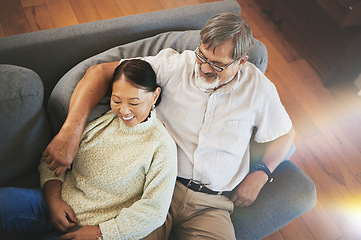 Image showing Relax, love and senior couple on a sofa hugging, bonding and laying together in the living room. Happy, smile and elderly man and woman in retirement resting on a weekend in the lounge at modern home