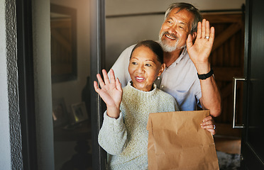 Image showing Mature couple, wave and delivery of package in home, commerce or cargo service at door. Asian man, happy woman and goodbye hand sign for communication, thank you for shipping parcel or smile together