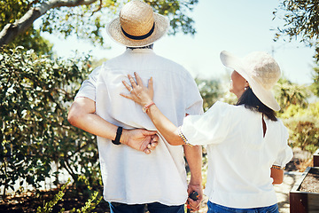 Image showing Senior couple, view and back in garden with smile, summer sunshine and bonding in retirement. Happy elderly man, old woman and outdoor with embrace, love and care in backyard to relax in Jakarta