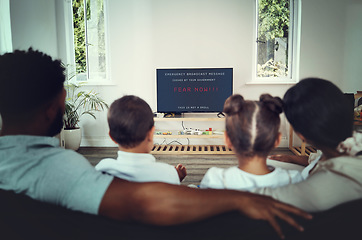 Image showing Back, family and watching tv for government announcement with people in their home during an emergency broadcast. Mother, father and children in the living room for fear propaganda in a disaster