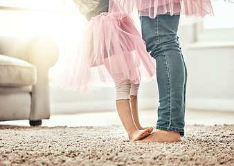 Image showing Ballet, feet and father with girl child in a living room with love, learning or dance in their home together. Family time, bond and legs of kid with parent in a house for support, care and security