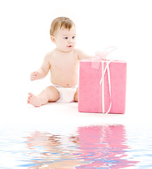 Image showing baby boy in diaper with big gift box