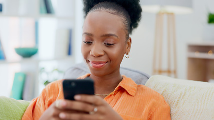 Image showing Social media, phone or black woman on sofa to relax in communication in house living room. Smile, scroll or African person texting or reading online gossip on a mobile app discussion on couch at home